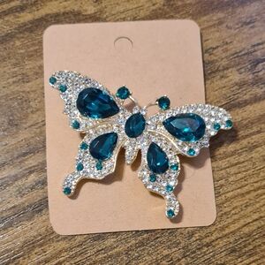 Elegant Butterfly Brooch with Green and Gold Accents.